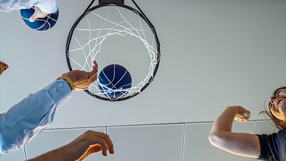 People play basketball.