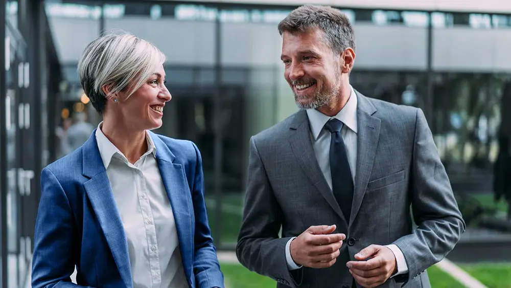 Two experts, a man and a woman in a lively discussion. 