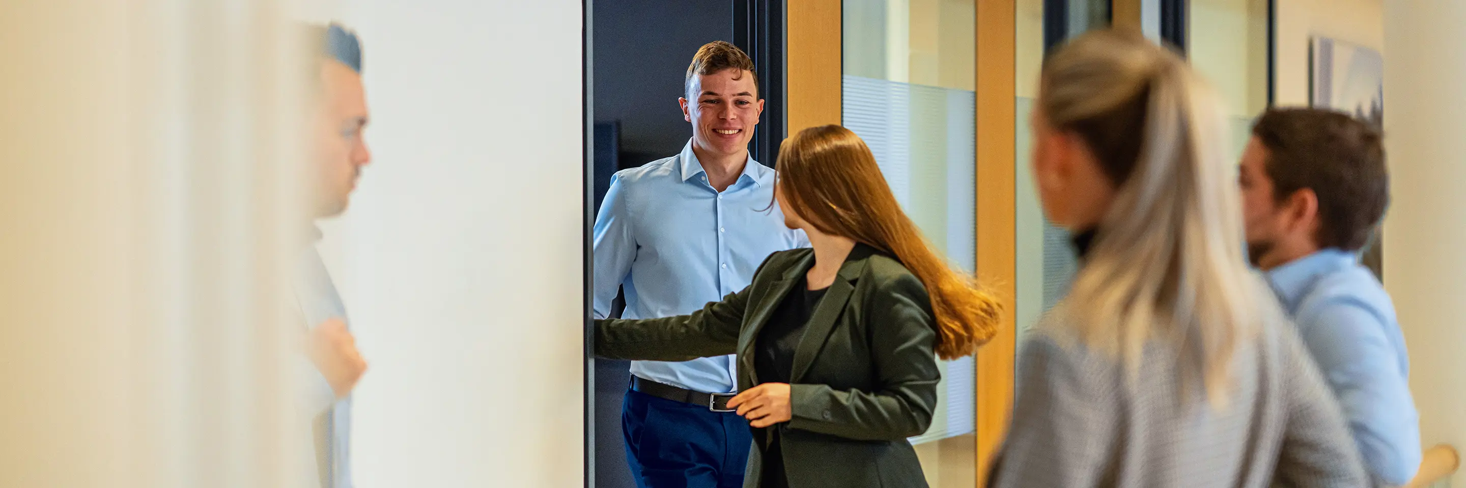 People coming out of a meeting room