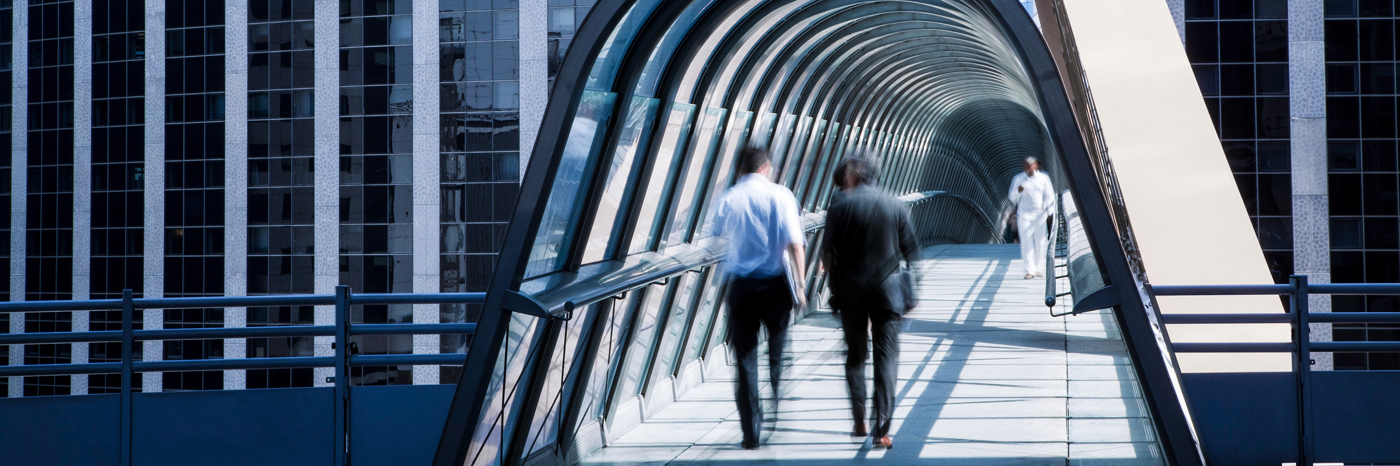People walking through an entrance to a building.